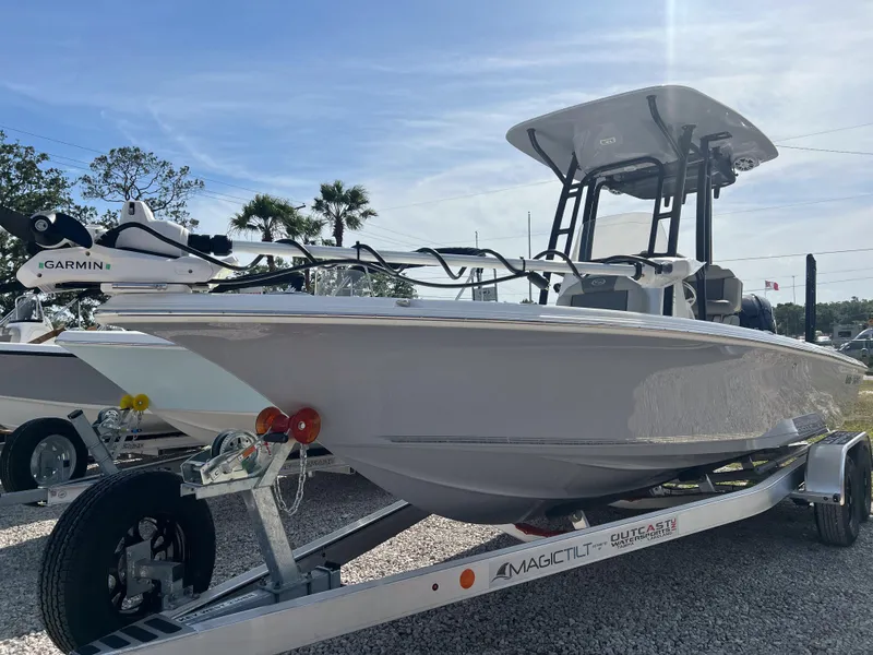 Slide: The Image of 2025 Key West 230 Bay Reef boat on trailer, featuring Garmin equipment, under clear blue sky. - 8