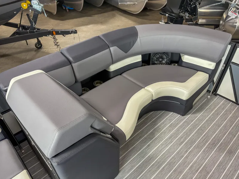 Slide: The Image of 2025 Trifecta 23 RF SS boat interior with gray and cream seating on striped flooring. - 4