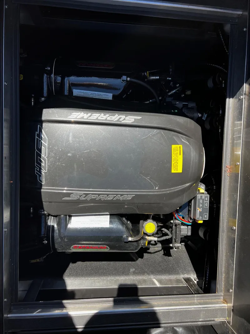 Slide: The Image of 2019 Supreme ZS232 engine compartment, showcasing powerful marine engine components. - 15