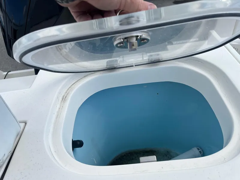 Slide: The Image of Open livewell on 2022 Cobia 237 Center Console boat. - 10