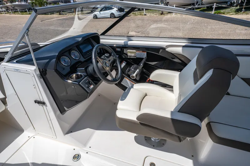 Slide: The Image of Interior of 2015 Yamaha Boats 242 Limited S, featuring helm and seating area. - 14