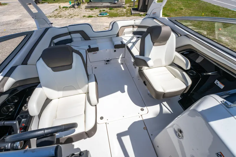 Slide: The Image of 2015 Yamaha Boats 242 Limited S interior with white seating and modern design. - 15