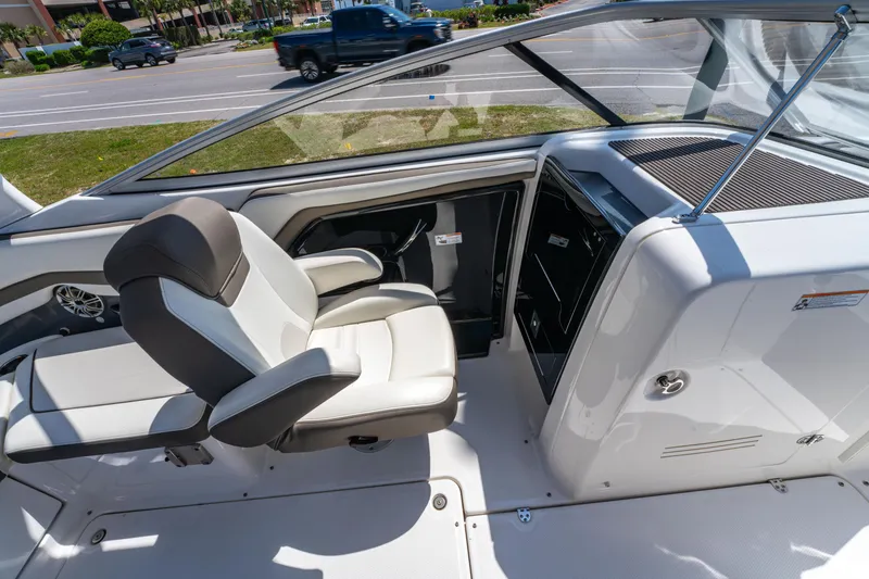 Slide: The Image of 2015 Yamaha Boats 242 Limited S interior with seating and dashboard view. - 16