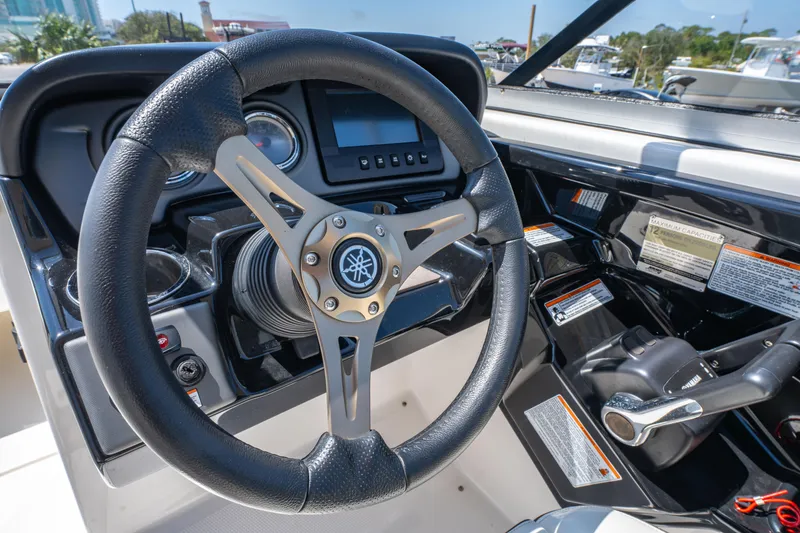 Slide: The Image of Steering wheel and controls of 2015 Yamaha Boats 242 Limited S. - 19