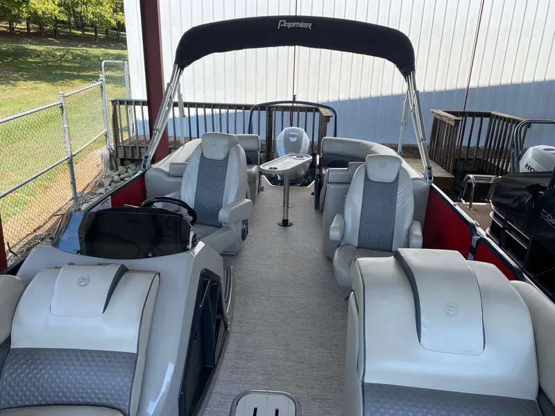 Slide: The Image of 2021 Premier 230 Solaris RF pontoon boat with spacious seating and canopy. - 4