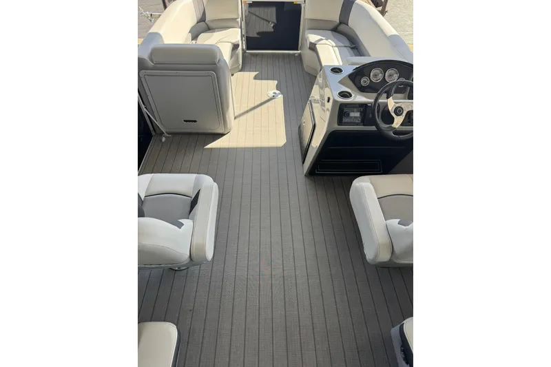 Slide: The Image of Interior of 2025 SunCatcher Select 20RC pontoon boat with seating and steering console. - 2
