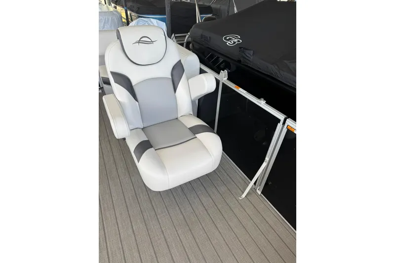Slide: The Image of 2025 SunCatcher Select 20RC boat seat, white and gray, on a deck. - 4