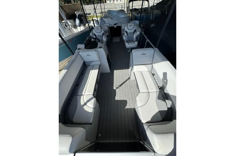 Slide: The Image of 2025 SunCatcher Select 20RC pontoon boat interior with spacious seating and modern design. - 9