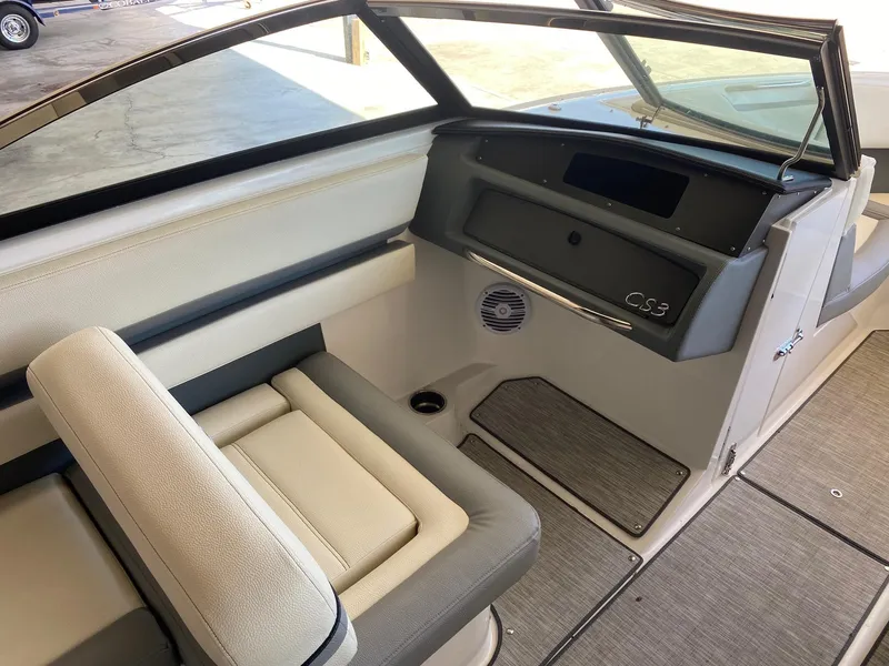Slide: The Image of 2022 Cobalt CS23 Surf boat interior with seating and dashboard view. - 6