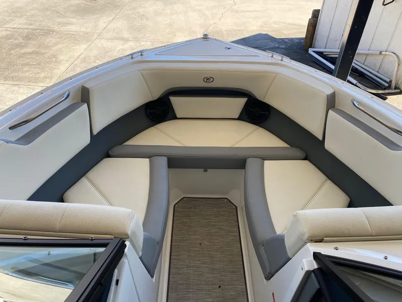 Slide: The Image of 2022 Cobalt CS23 Surf boat interior with cushioned seating and sleek design. - 7