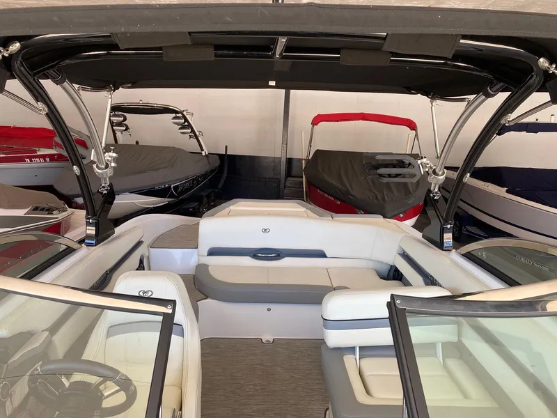 Slide: The Image of 2022 Cobalt CS23 Surf boat interior with sleek seating and modern design. - 8