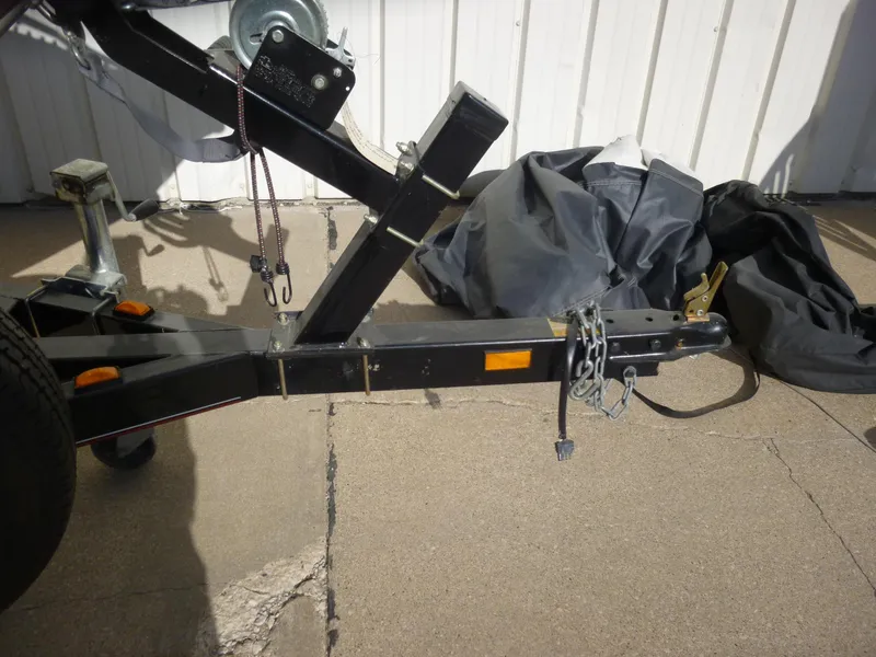 Slide: The Image of Trailer hitch of a 2004 Bass Tracker Targa 16 WT boat, parked on concrete. - 10