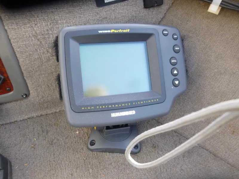 Slide: The Image of Humminbird fishfinder on 2004 Bass Tracker Targa 16 WT boat, carpeted floor background. - 13