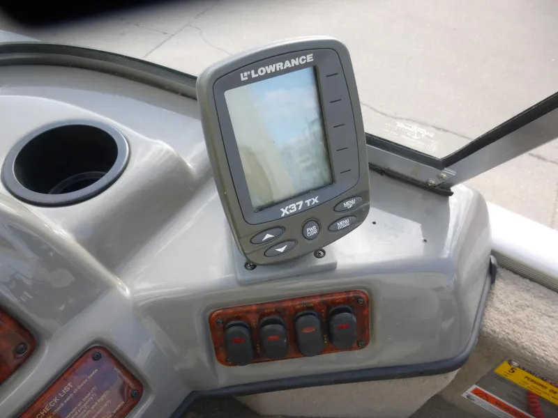 Slide: The Image of Console of 2004 Bass Tracker Targa 16 WT with Lowrance X37 TX fish finder. - 14