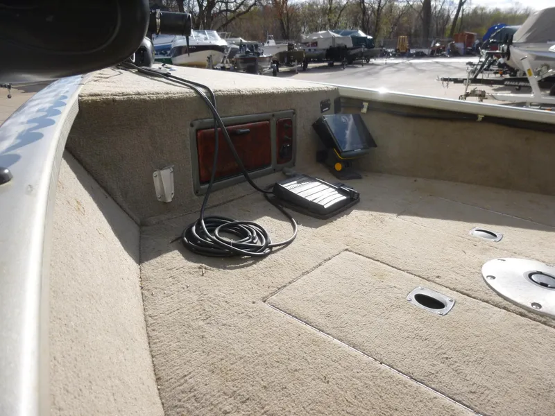 Slide: The Image of 2004 Bass Tracker Targa 16 WT boat interior with control panel and wiring. - 16