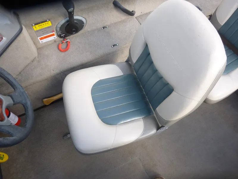 Slide: The Image of 2004 Bass Tracker Targa 16 WT boat interior with white and blue seating. - 29