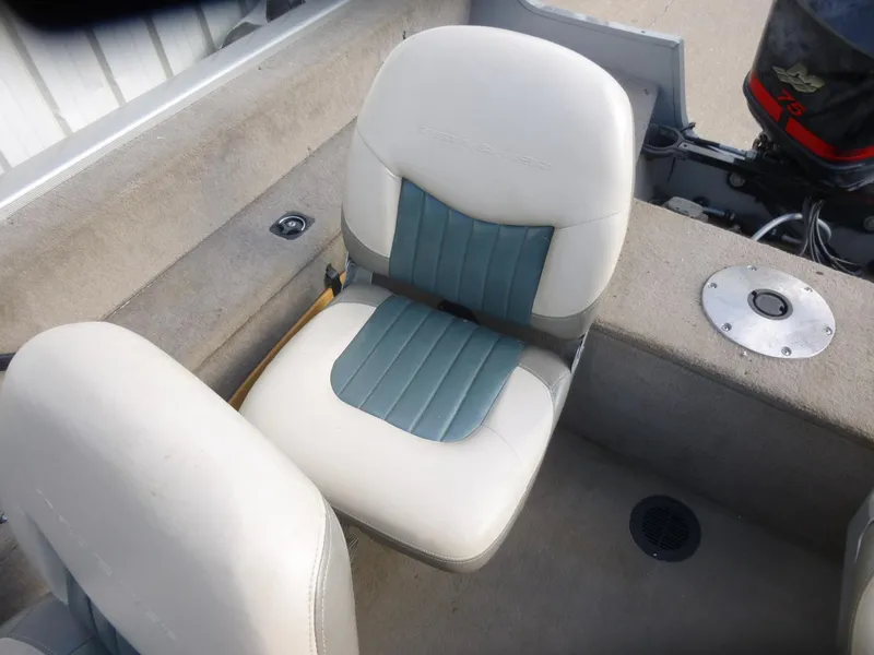 Slide: The Image of 2004 Bass Tracker Targa 16 WT boat seat with blue and white upholstery. - 30
