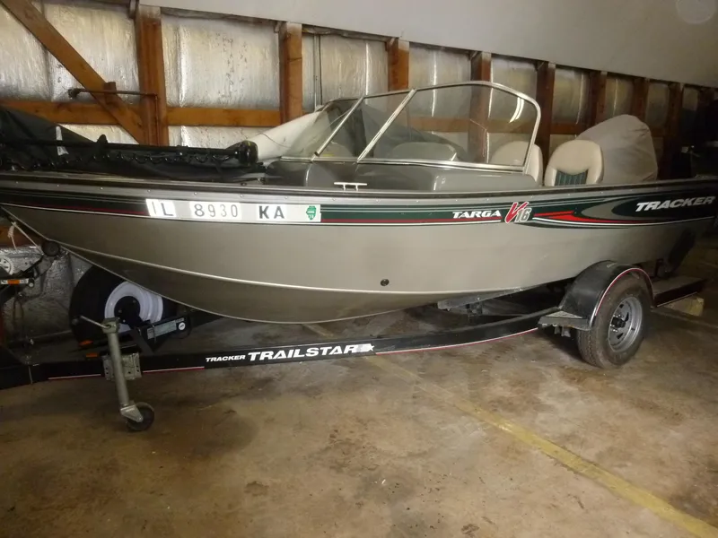 Slide: The Image of 2004 Bass Tracker Targa 16 WT boat on a trailer in a garage. - 6