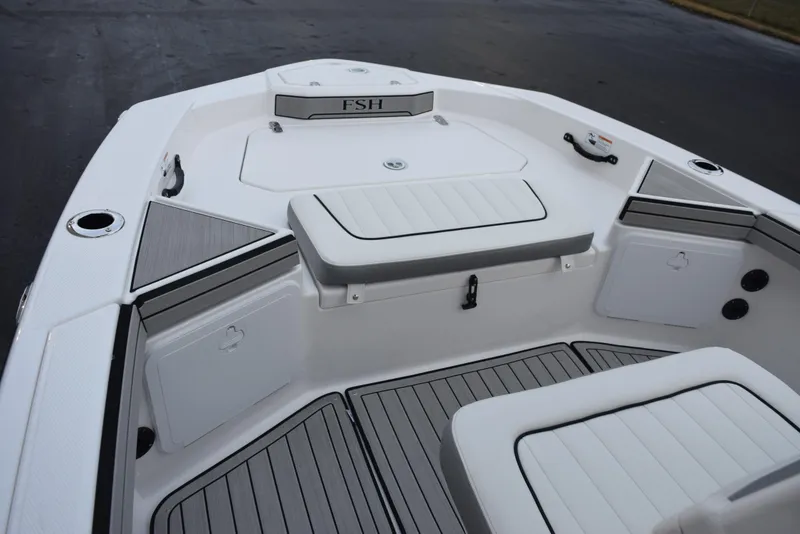 Slide: The Image of 2025 Yamaha Boats 195 FSH Sport interior, featuring sleek seating and storage compartments. - 10