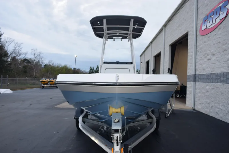 Slide: The Image of 2025 Yamaha Boats 195 FSH Sport on trailer, parked outside a building. - 3