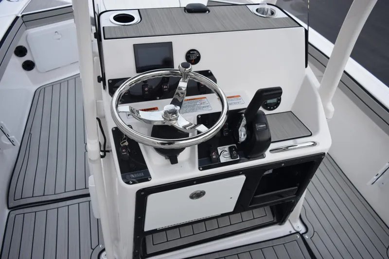 Slide: The Image of 2025 Yamaha Boats 195 FSH Sport dashboard with steering wheel and controls. - 8