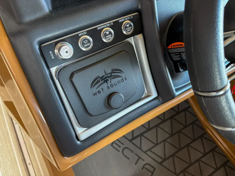 Slide: The Image of 2025 Trifecta 23 RF SS dashboard featuring Wet Sounds audio control panel. - 11