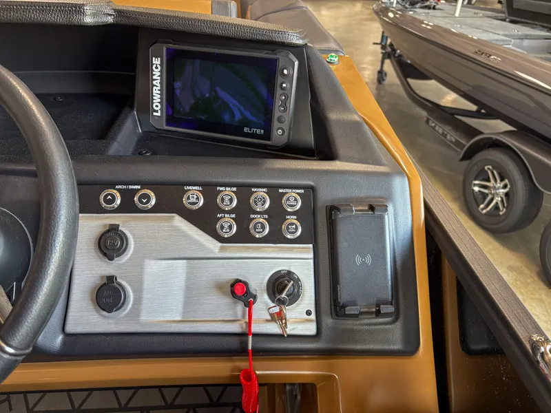 Slide: The Image of Control panel of 2025 Trifecta 23 RF SS boat with Lowrance Elite display. - 12
