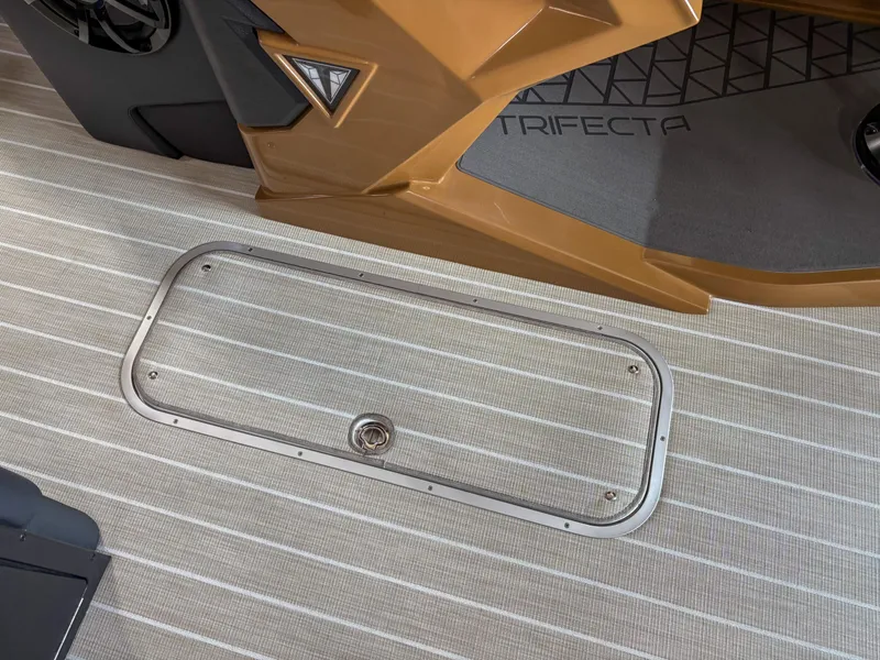Slide: The Image of 2025 Trifecta 23 RF SS boat interior with sleek flooring and modern design elements. - 14