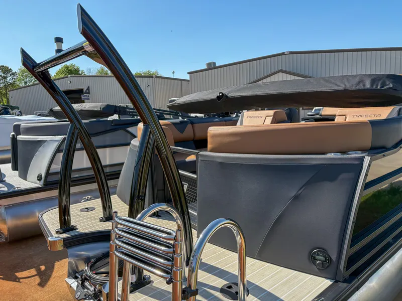 Slide: The Image of 2025 Trifecta 23 RF SS pontoon boat with sleek design and modern features. - 3