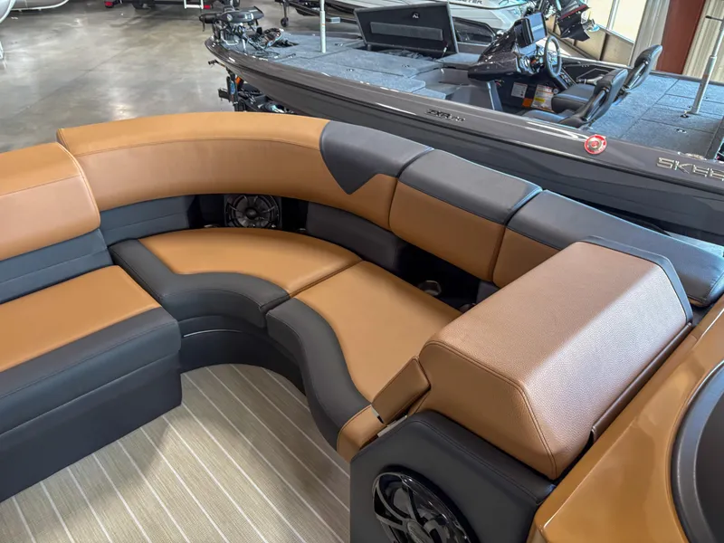 Slide: The Image of Luxurious seating on 2025 Trifecta 23 RF SS pontoon boat, featuring brown and gray upholstery. - 6