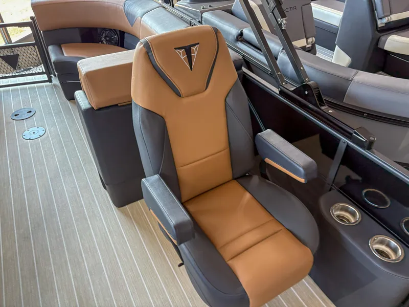 Slide: The Image of Captain's chair in 2025 Trifecta 23 RF SS boat, featuring brown and black upholstery. - 7