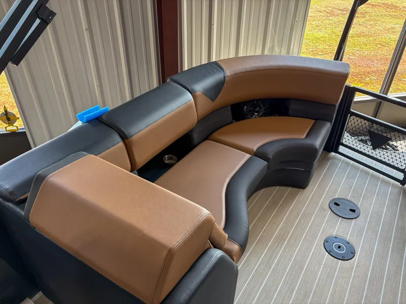 Slide: The Image of Luxurious seating in 2025 Trifecta 23 RF SS boat, featuring brown and black upholstery. - 9