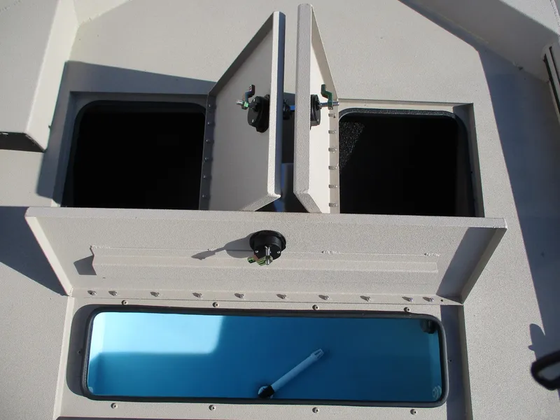 Slide: The Image of Avid 18 Commander 2025 boat storage compartments and livewell, top view. - 12