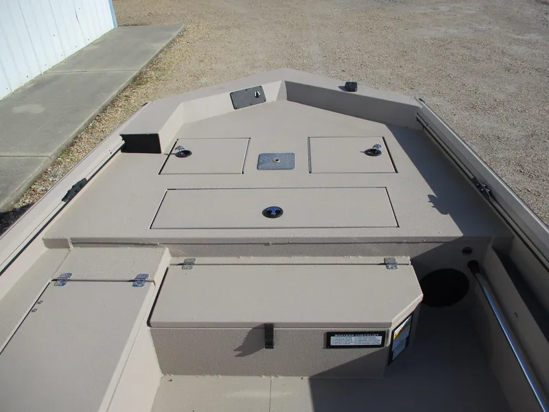 Slide: The Image of 2025 Avid 18 Commander boat deck with storage compartments and clean design. - 13