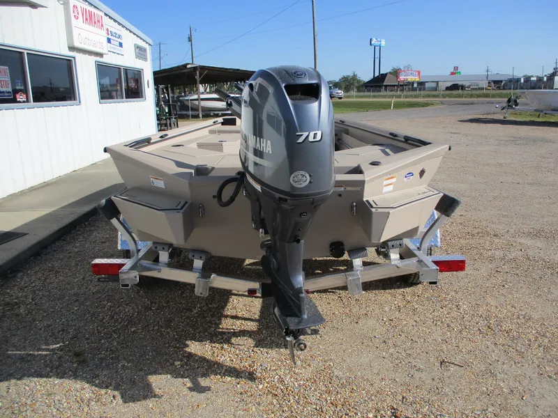 Slide: The Image of 2025 Avid 18 Commander boat with Yamaha 70 outboard motor on a trailer. - 6
