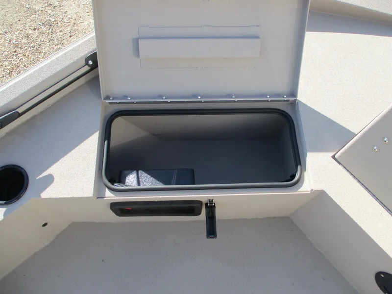 Slide: The Image of Open storage compartment on 2025 Avid 18 Commander boat. - 7