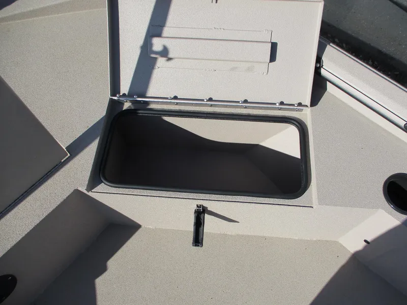 Slide: The Image of Open storage compartment on 2025 Avid 18 Commander boat deck. - 8