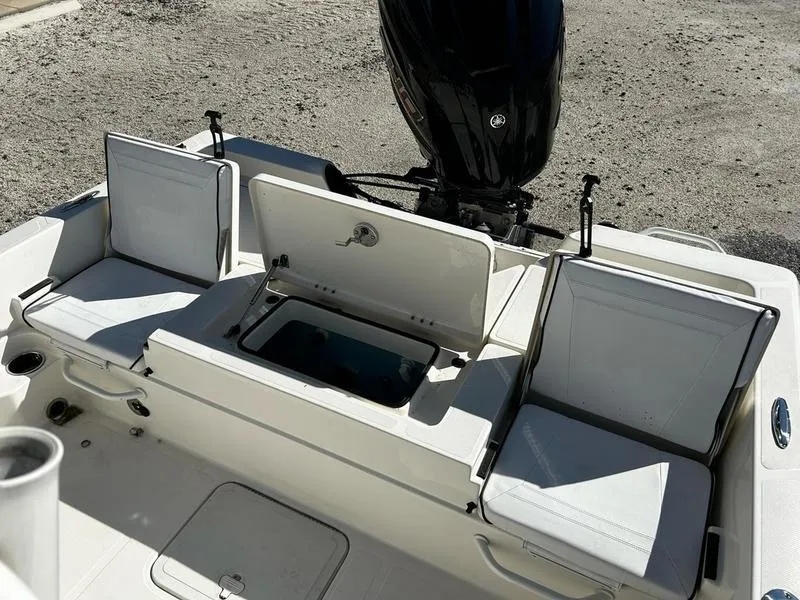 Slide: The Image of 2024 Skeeter SX230 boat interior with seating and storage compartments. - 12