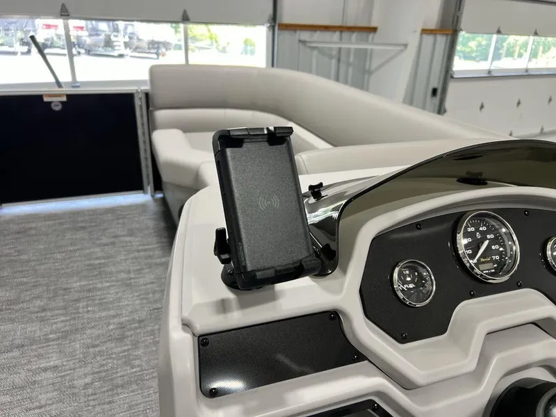 Slide: The Image of 2025 Godfrey Xperience 2086 CX boat interior with dashboard and seating area. - 11