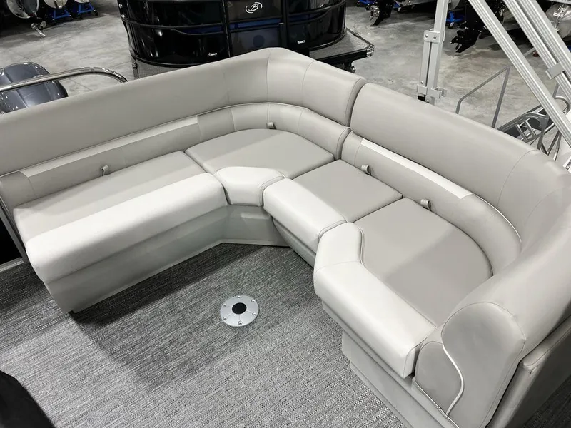 Slide: The Image of Luxurious seating on 2025 Godfrey Xperience 2086 CX pontoon boat, featuring plush gray upholstery. - 14