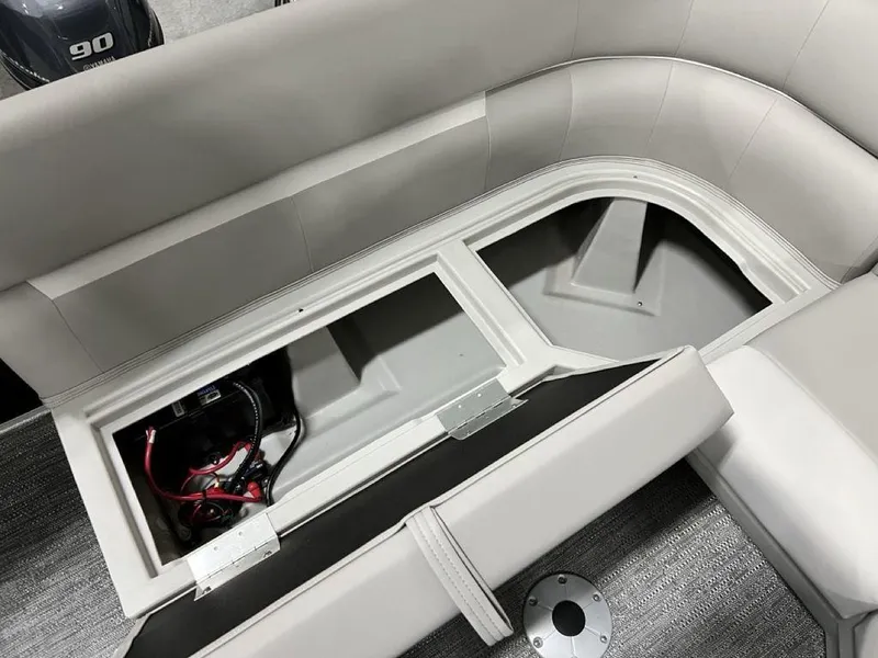 Slide: The Image of Interior view of 2025 Godfrey Xperience 2086 CX boat with open storage compartment. - 15