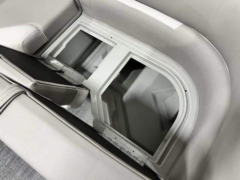 Slide: The Image of Interior storage compartment of 2025 Godfrey Xperience 2086 CX boat, featuring sleek seating design. - 16