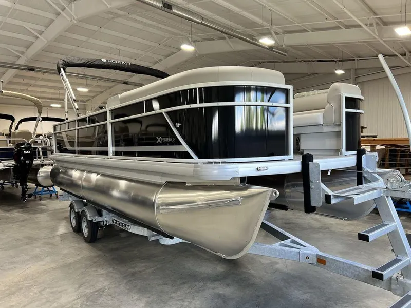 Slide: The Image of 2025 Godfrey Xperience 2086 CX pontoon boat in a showroom on a trailer. - 3