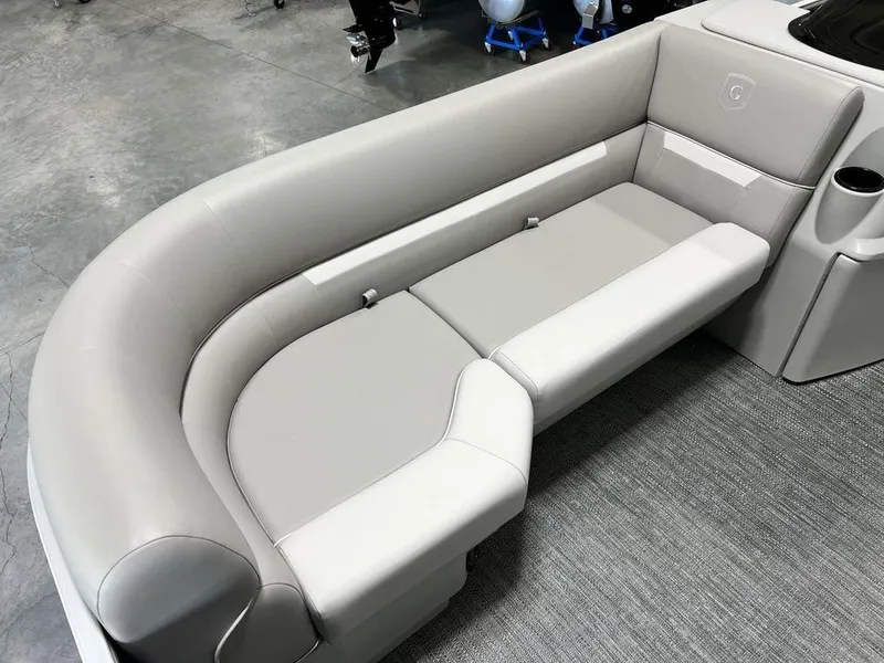 Slide: The Image of 2025 Godfrey Xperience 2086 CX boat interior with sleek gray seating and cup holder. - 5