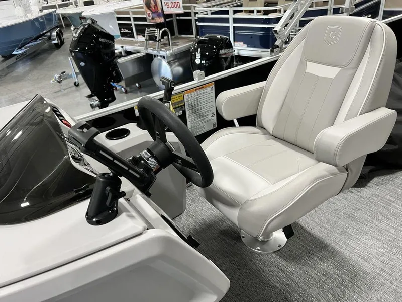 Slide: The Image of Captain's seat and helm of 2025 Godfrey Xperience 2086 CX boat. - 9