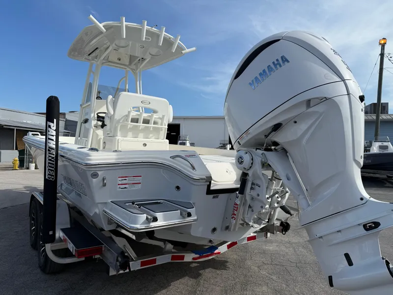 Slide: The Image of 2025 Pathfinder 2600 TRS boat with Yamaha engine on trailer, outdoor setting. - 6