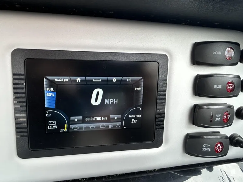 Slide: The Image of Dashboard of 2021 Yamaha Boats SX 210 showing speedometer and control buttons. - 3