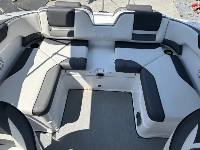 Slide: The Image of 2021 Yamaha Boats SX 210 interior with spacious seating and modern design. - 6
