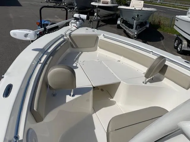 Slide: The Image of 2021 Key West 239 FS boat interior with seating and storage compartments. - 10