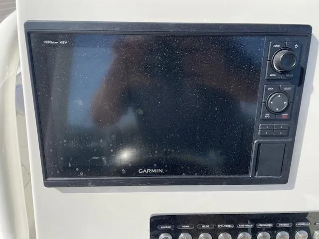 Slide: The Image of Garmin GPS display on 2021 Key West 239 FS boat dashboard. - 16